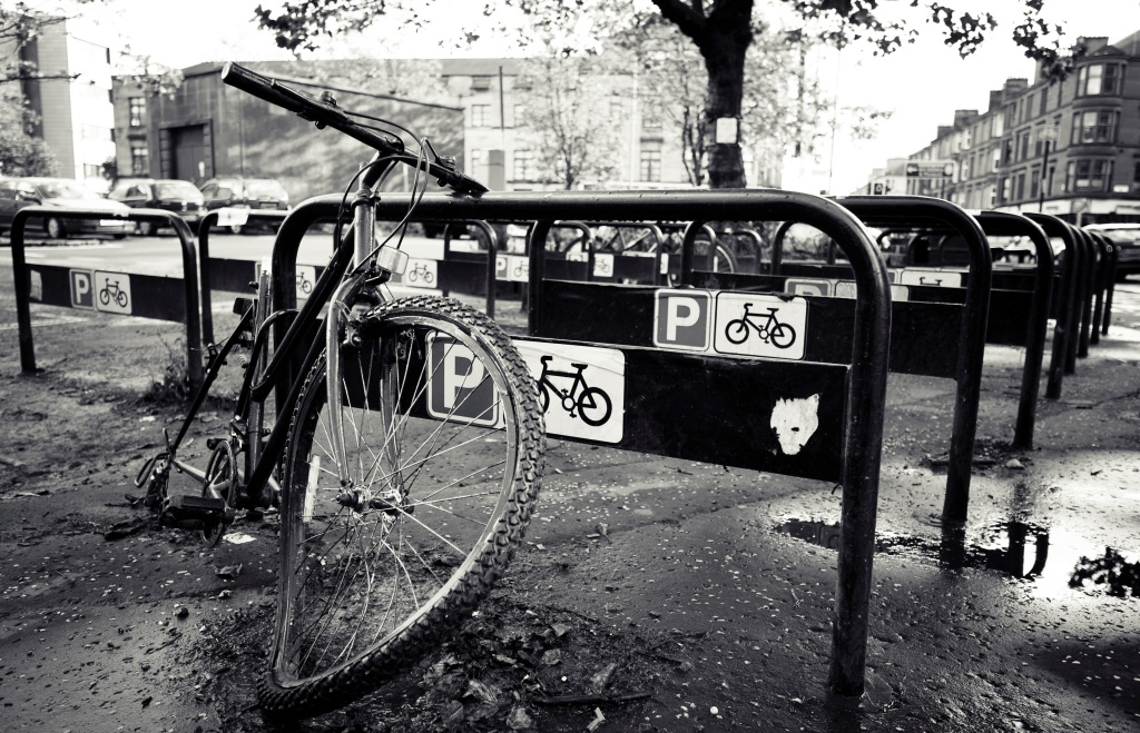 A photo of a damaged bicycle on a street in Glasgow